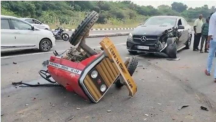 Tractor splits in half after colliding with Mercedes Benz Car Tractor splits in half after colliding with Mercedes Benz Car