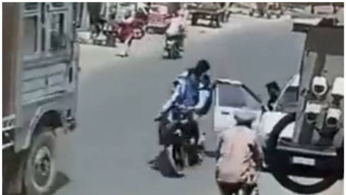 careless driver opens car door.. results bikers accident with lorry in a viral video careless driver opens car door.. results bikers accident with lorry in a viral video