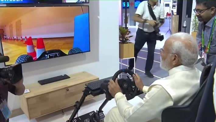 5G launch in India: PM Narendra Modi test driving a car in Europe from Delhi using 5G AJR 5G launch in India: PM Narendra Modi test driving a car in Europe from Delhi using 5G AJR
