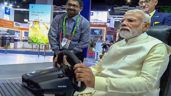 Using 5G link PM Modi drives car in Sweden from Delhi vva Using 5G link PM Modi drives car in Sweden from Delhi vva