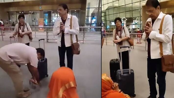 viral video of ramayan fame actor arun govil, woman touched his feet at the airport AKA viral video of ramayan fame actor arun govil, woman touched his feet at the airport AKA
