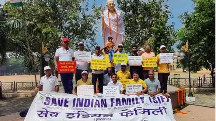 People harassed by wife staged a sit in in front of Gandhi statue uja People harassed by wife staged a sit in in front of Gandhi statue uja