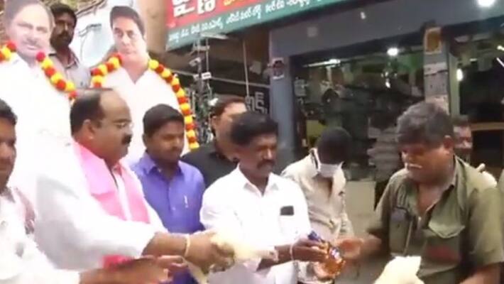 kcr new national party trs leader distributes liquor bottles and chicken to locals in warangal kcr new national party trs leader distributes liquor bottles and chicken to locals in warangal