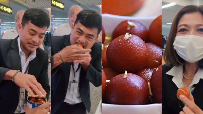 youth offers gulab jamuns to security officers in Phuket airport as they stopped him from carrying it youth offers gulab jamuns to security officers in Phuket airport as they stopped him from carrying it