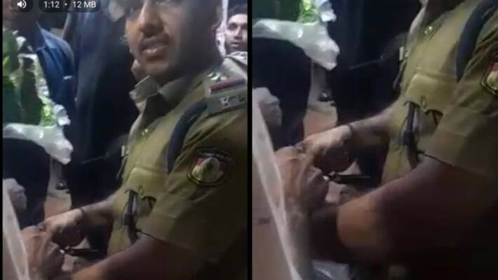 Sub inspector syam kiran catches a Indian Python at thiruvananthapuram Sub inspector syam kiran catches a Indian Python at thiruvananthapuram