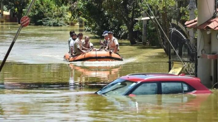 The car was swept away by the flood in the river in Andhra Pradesh The car was swept away by the flood in the river in Andhra Pradesh