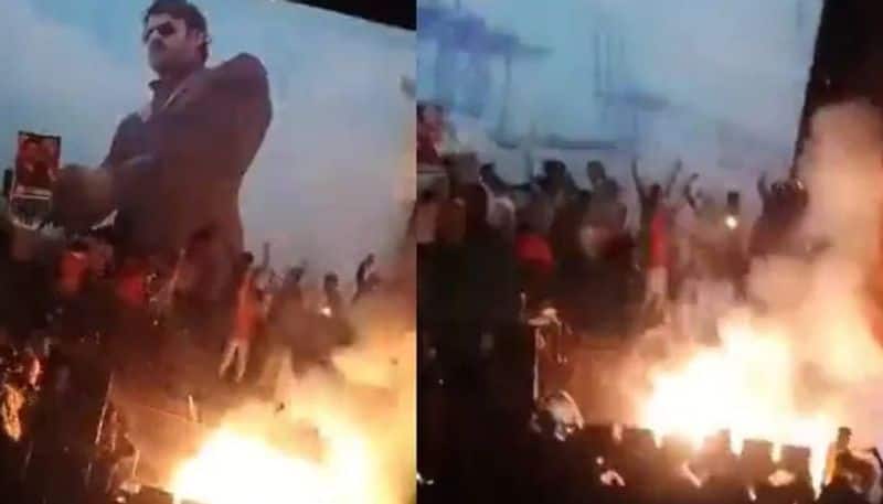 Prabhas fan light firecrackers in theatre no injuries vcs 