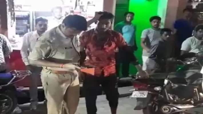 Jhansi Drunken young mans hair many slaps video of police brutality in Jhansi market went viral Jhansi Drunken young mans hair many slaps video of police brutality in Jhansi market went viral