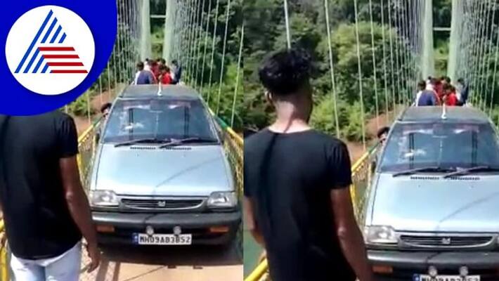 Driving a car on the bridge is a tourist at yallapur uttarakannada rav Driving a car on the bridge is a tourist at yallapur uttarakannada rav