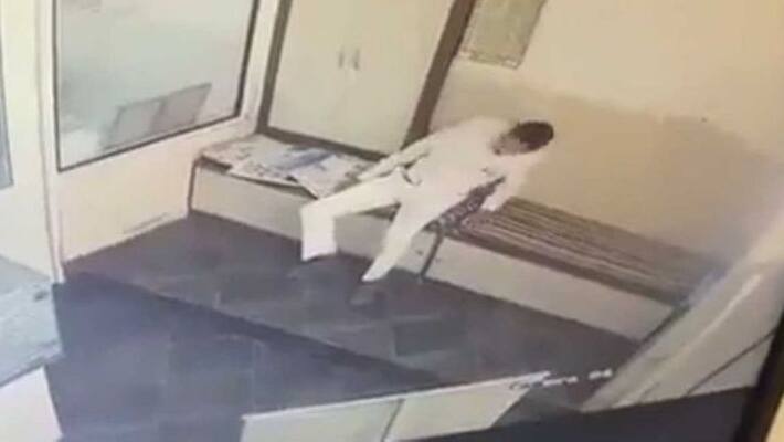 Business man collapsed while reading news paper Business man collapsed while reading news paper