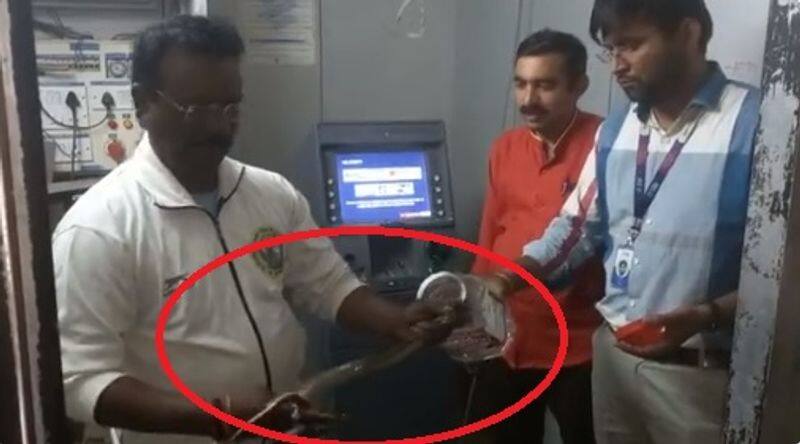snake caught from atm machine in maharashtra and video goes viral