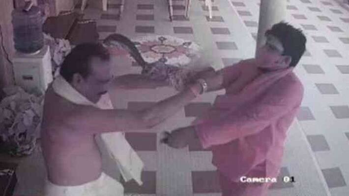 Andhra Pradesh TDP leader murder attempt in Kakinad Man dressed as priest attacks former MP Seshagiri, incident captured in cctv akb Andhra Pradesh TDP leader murder attempt in Kakinad Man dressed as priest attacks former MP Seshagiri, incident captured in cctv akb