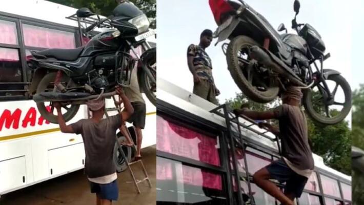 what a balance, labourer climbs bus keeping bike on his head, Internet salutes his Enormous strength akb what a balance, labourer climbs bus keeping bike on his head, Internet salutes his Enormous strength akb