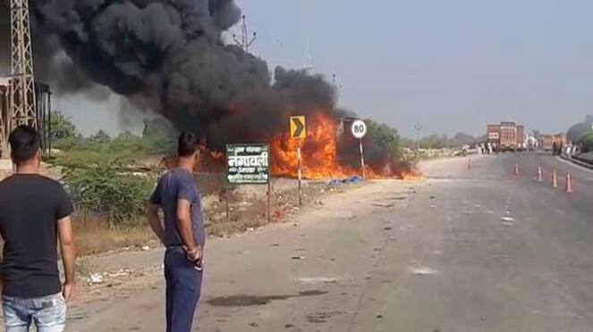 udaipur news moving truck catch fire driver cleaner save their life by jumping off asc