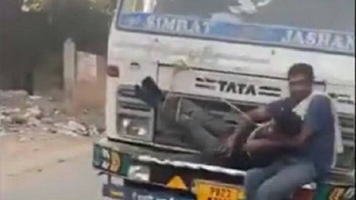 man accused of stealing wheat bags tied to moving trucks bonnet in punjab viral video ash man accused of stealing wheat bags tied to moving trucks bonnet in punjab viral video ash