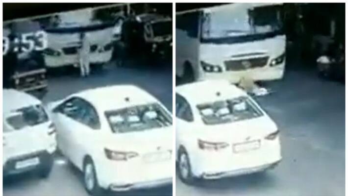 mumbai man run over by bus, escapes unhurt viral video mumbai man run over by bus, escapes unhurt viral video