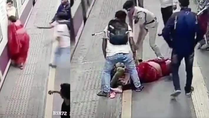 Indian railway police saved woman and daughter life, who was fell down from moving train after they trying to board moving train akb Indian railway police saved woman and daughter life, who was fell down from moving train after they trying to board moving train akb