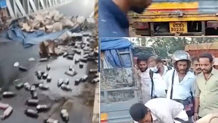 kerala liquor drunker happy after liquor transport truck hit into bridge in Keralas Kozhikode akb kerala liquor drunker happy after liquor transport truck hit into bridge in Keralas Kozhikode akb