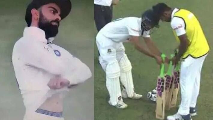 Virat Kohli gestures towards bangladesh batsmen to take off jersey to waste more time in second test video goes viral Virat Kohli gestures towards bangladesh batsmen to take off jersey to waste more time in second test video goes viral