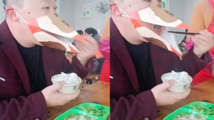 Man Uses Beak Shaped Mask To Eat Rice At Restaurant Man Uses Beak Shaped Mask To Eat Rice At Restaurant