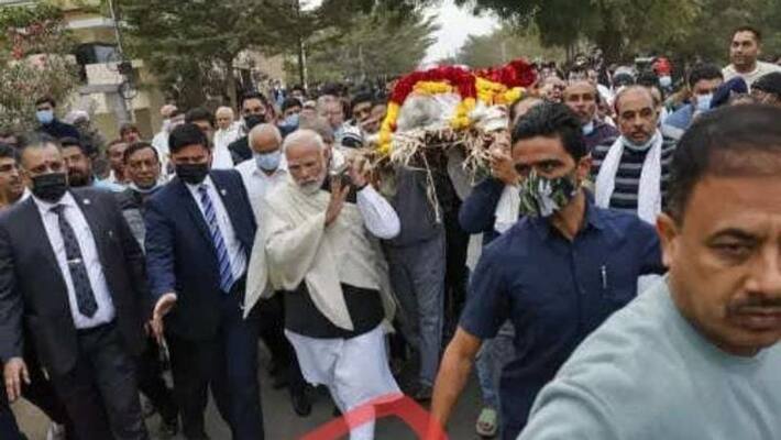 PM Modi carries her mother with barefoot PM Modi carries her mother with barefoot