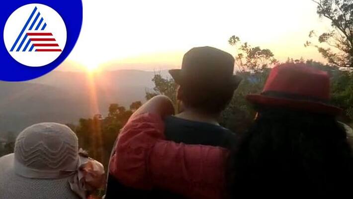 Tourists watching the last sunset of the year at kodagu gvd Tourists watching the last sunset of the year at kodagu gvd