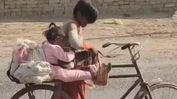video of a brother who made sure his little sister was safe on his bicycle watch viral video ash video of a brother who made sure his little sister was safe on his bicycle watch viral video ash