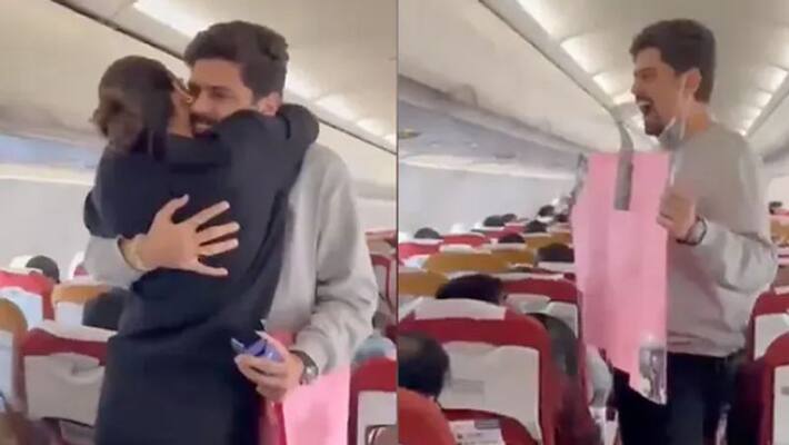 Man Surprises Girlfriend On Flight Proposes MidAir Video Goes Viral Man Surprises Girlfriend On Flight Proposes MidAir Video Goes Viral