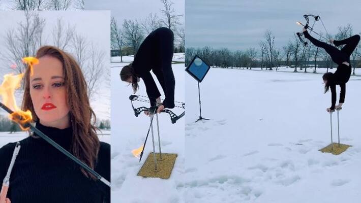 womans great talent video goes viral, shoots flaming arrow by foot while handstand akb womans great talent video goes viral, shoots flaming arrow by foot while handstand akb
