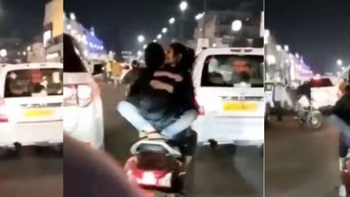 Lucknow police searching for couple after video of them romancing on scooty goes viral Lucknow police searching for couple after video of them romancing on scooty goes viral