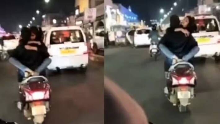 Watch: Driver detained for romancing on scooter after video goes viral Watch: Driver detained for romancing on scooter after video goes viral