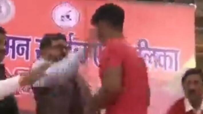 Brijbhushan Sharan Singh slaps wrestler in public-Watch Brijbhushan Sharan Singh slaps wrestler in public-Watch
