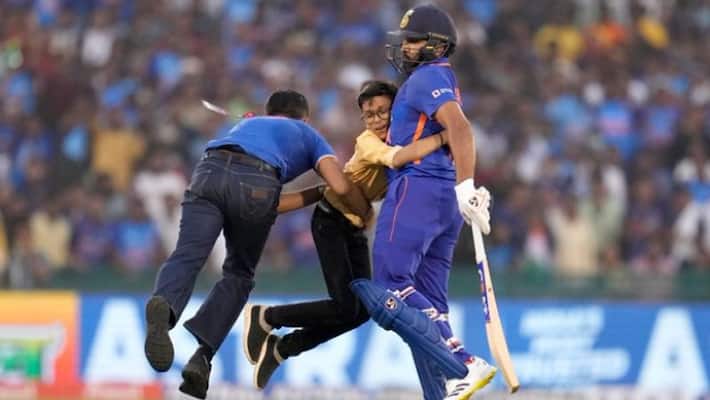 INDvsNZ : A Fan Invaded into Ground, Hugs Rohit Sharma During The Match, Watch Viral Video MSV INDvsNZ : A Fan Invaded into Ground, Hugs Rohit Sharma During The Match, Watch Viral Video MSV