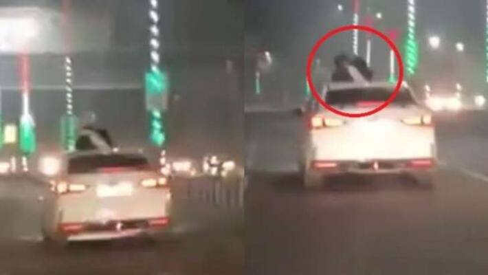 A couple of romance atop moving car in cold Lucknow video goes viral A couple of romance atop moving car in cold Lucknow video goes viral