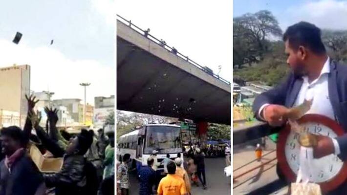 Its raining money in Bengaluru Man throws bundle of cash from KR flyover Video Viral Its raining money in Bengaluru Man throws bundle of cash from KR flyover Video Viral