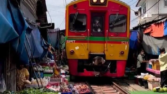 a food market which is set on railway tracks a food market which is set on railway tracks