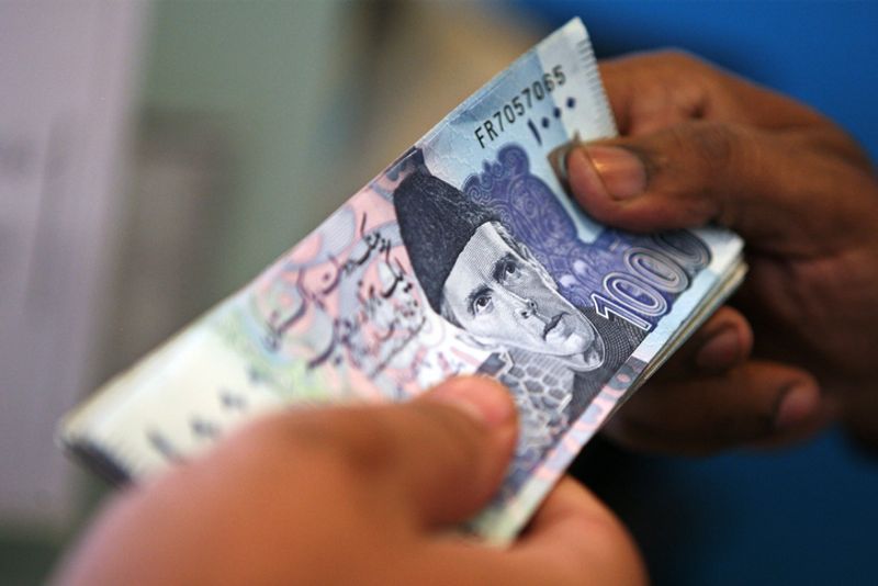 Pakistans currency slumps to Rs 262.6 per US dollar as foreign exchange reserves shrink.