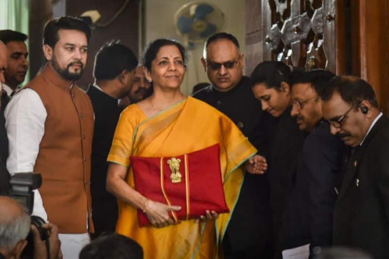 Sitharaman brings a tablet in a red bag to Parliament to introduce a paperless budget.