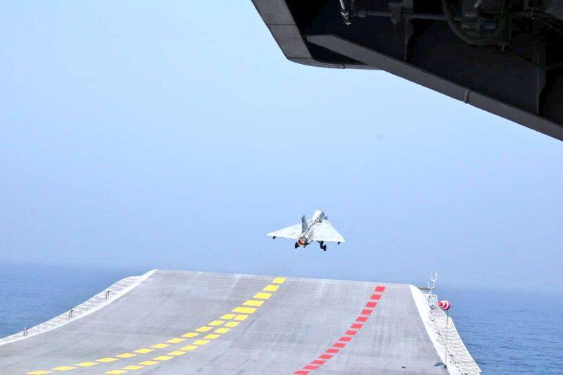 Naval LCA Tejas conducts its historic maiden landing at INS Vikrant.