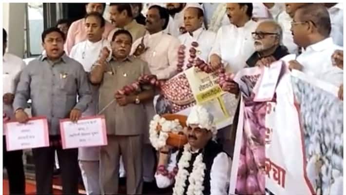 ncp mlas protest with onion garland at maharashtra assembly