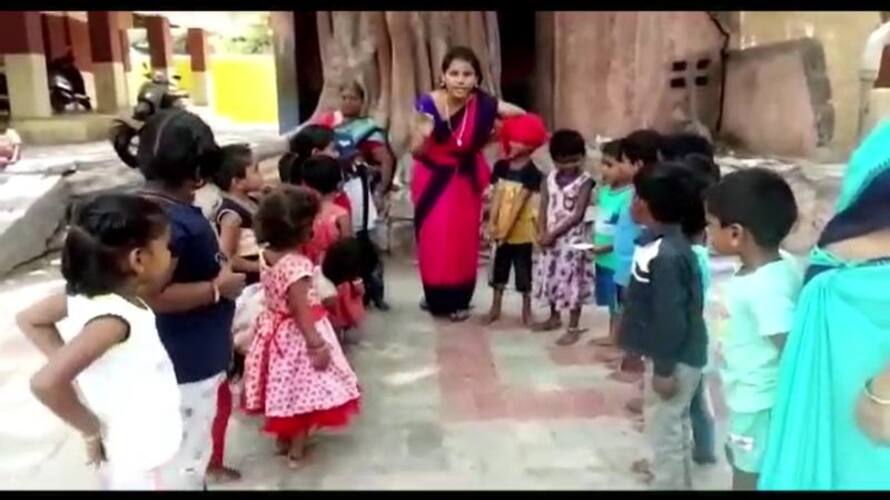 a government school teacher play dance and sing song for To attract students' attention a government school teacher play dance and sing song for To attract students' attention
