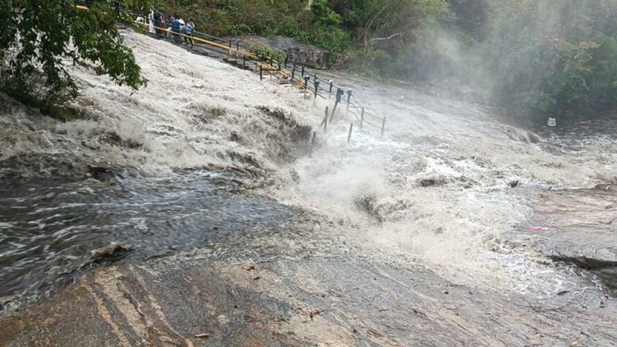 Rescue of tourists trapped in flood at Kumbakarai waterfall Rescue of tourists trapped in flood at Kumbakarai waterfall