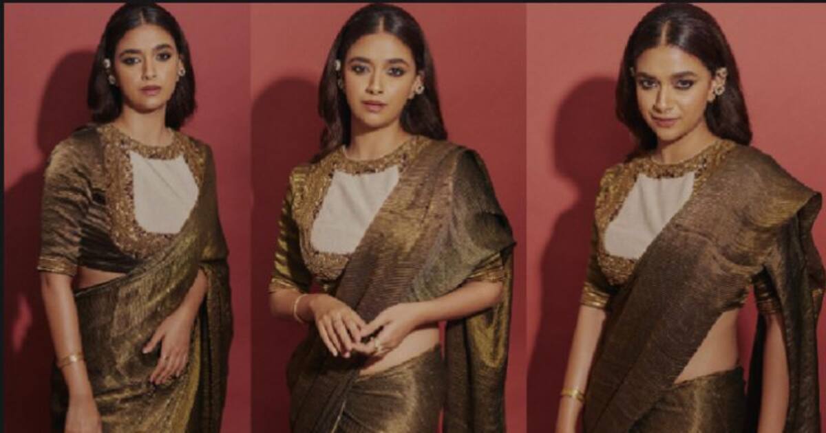 தங்கம்போல் தகதகவென மின்னும் சேலையில்... இடுப்பழகு தெரிய போஸ் கொடுத்த கீர்த்தி சுரேஷ் - வைரலாகும் போட்டோஸ்