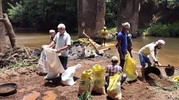 Attempt to Save Bridge from People by Sand Bag at Siddapur in Uttara Kannada grg Attempt to Save Bridge from People by Sand Bag at Siddapur in Uttara Kannada grg