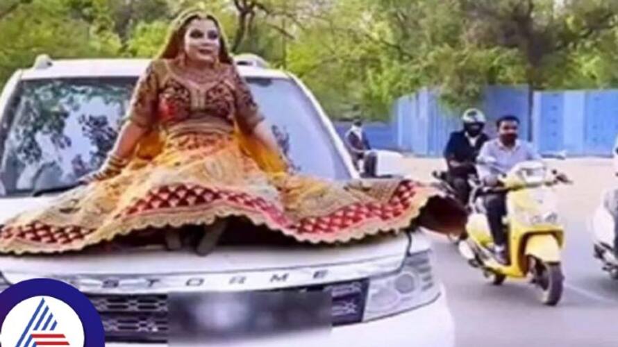 UP bride fined over Rs 15,000 for riding on top of a moving SUV; video goes viral Vin UP bride fined over Rs 15,000 for riding on top of a moving SUV; video goes viral Vin