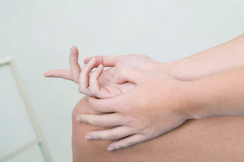 touching a palm pressure point benefits 