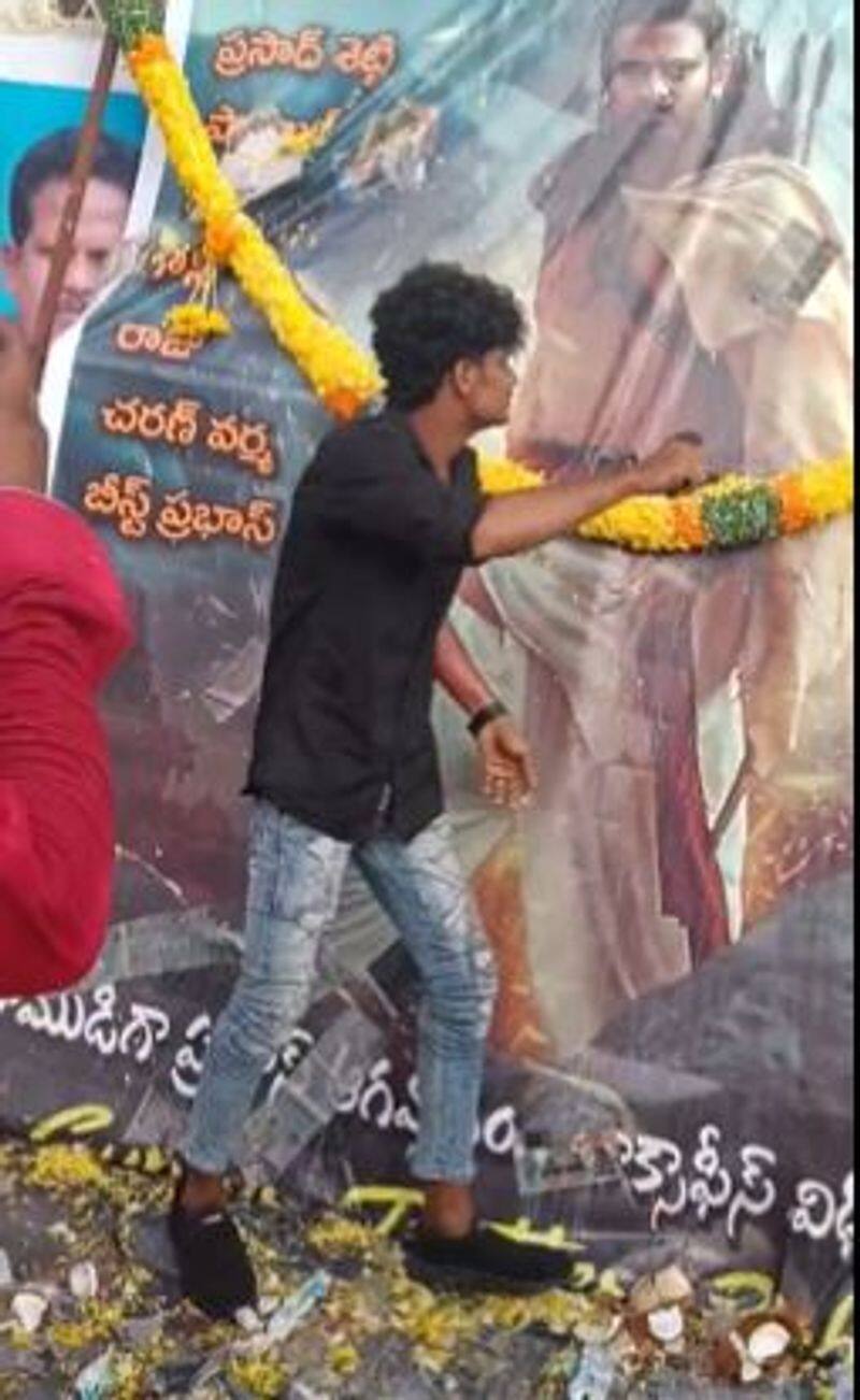 Actor Prabhas Fan Cuts Arm With Beer Bottle and Applies Blood On Adipurush Poster shocking video 