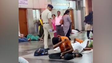 Video Shows Cop Pouring Water On People Sleeping On Railway Platform, Official Responds Video Shows Cop Pouring Water On People Sleeping On Railway Platform, Official Responds