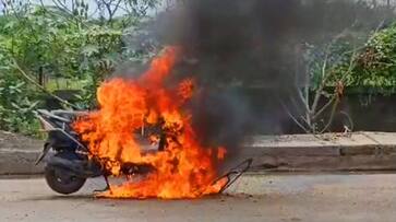Two wheeler suddenly burst into flames on Manali Expressway in Chennai Two wheeler suddenly burst into flames on Manali Expressway in Chennai