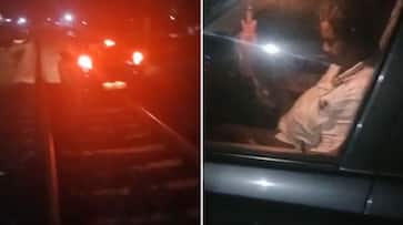 Drunk man drives car on railway tracks in Kerala ram Drunk man drives car on railway tracks in Kerala ram